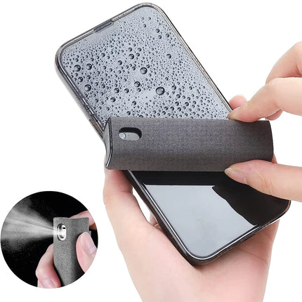 Portable Screen Cleaner Kit - user applying the spray to clean a smartphone screen with microfiber wipe in hand.